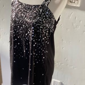 Black holiday top in jersey fabric Sequin detail.